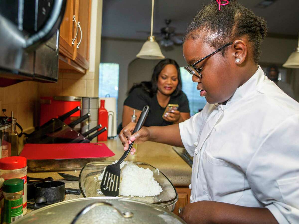 Victoria Taylor, 10, cooks at home with her mother, Tori Warford Scott. Scott became used to calls from teachers about her 10-year-old daughter disrupting her classroom, a result of attention deficit hyperactivity disorder. Last year, Victoria’s life changed when a family friend and chef took her under his wing and introduced her to the world of cooking. Now, she’s no longer disruptive and her focus is on recipes and preparing meals for her family.