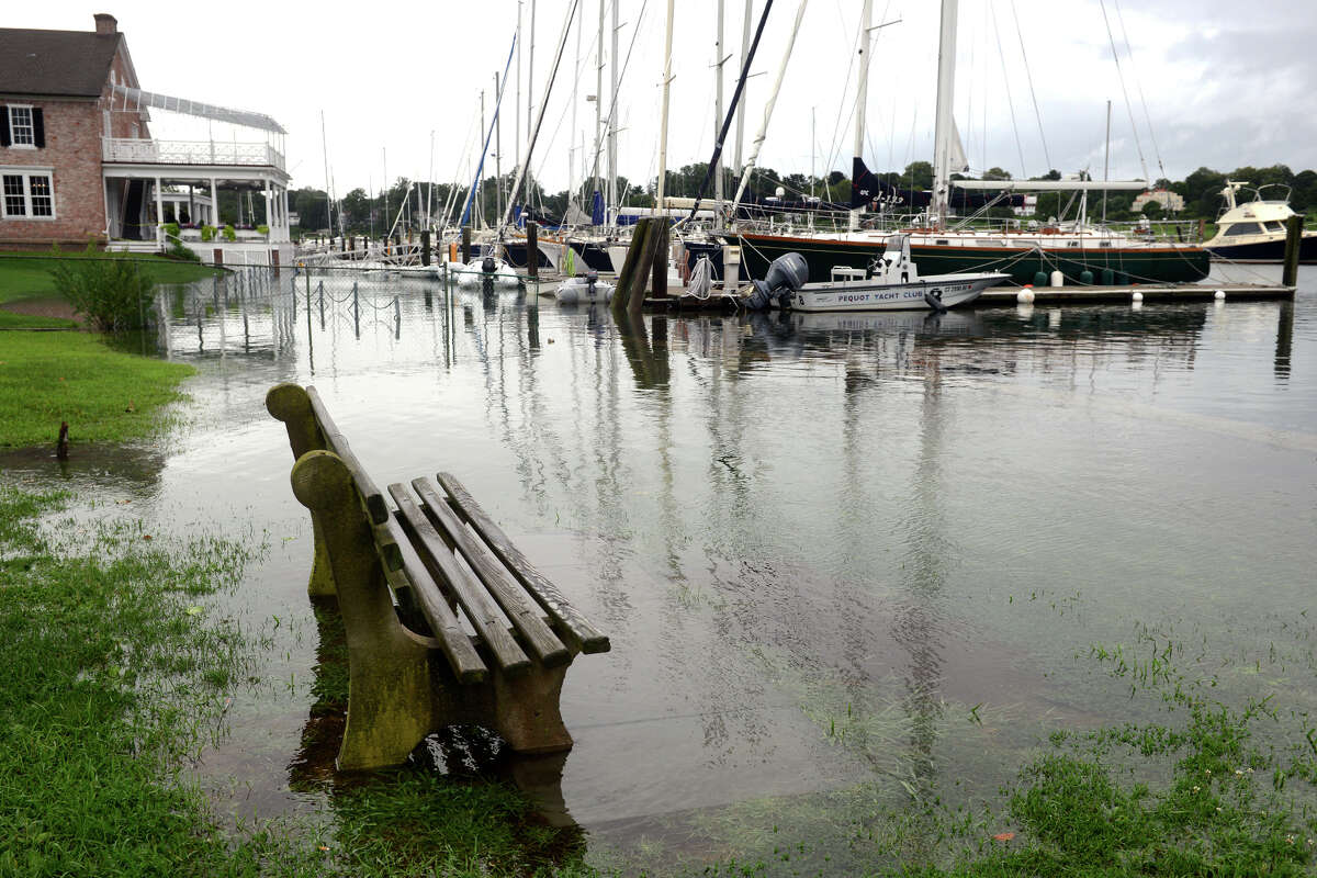 High tide brought the waters of Southport Harbor onto Perry's Green, in Fairfield, Conn. Aug 22, 2021. As Tropical Storm Henri passed farther to the east, most of coastal Fairfield County experienced an ordinary rainy day on Sunday.