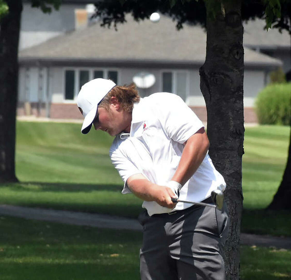 Alton’s Alec Schmieder hits a shot during Wednesday’s Madison County Meet at Belk Park in Wood River. On Saturday, Schmieder and the Redbirds were at the Quincy Invite and Alton placed ninth at Westview golf course.