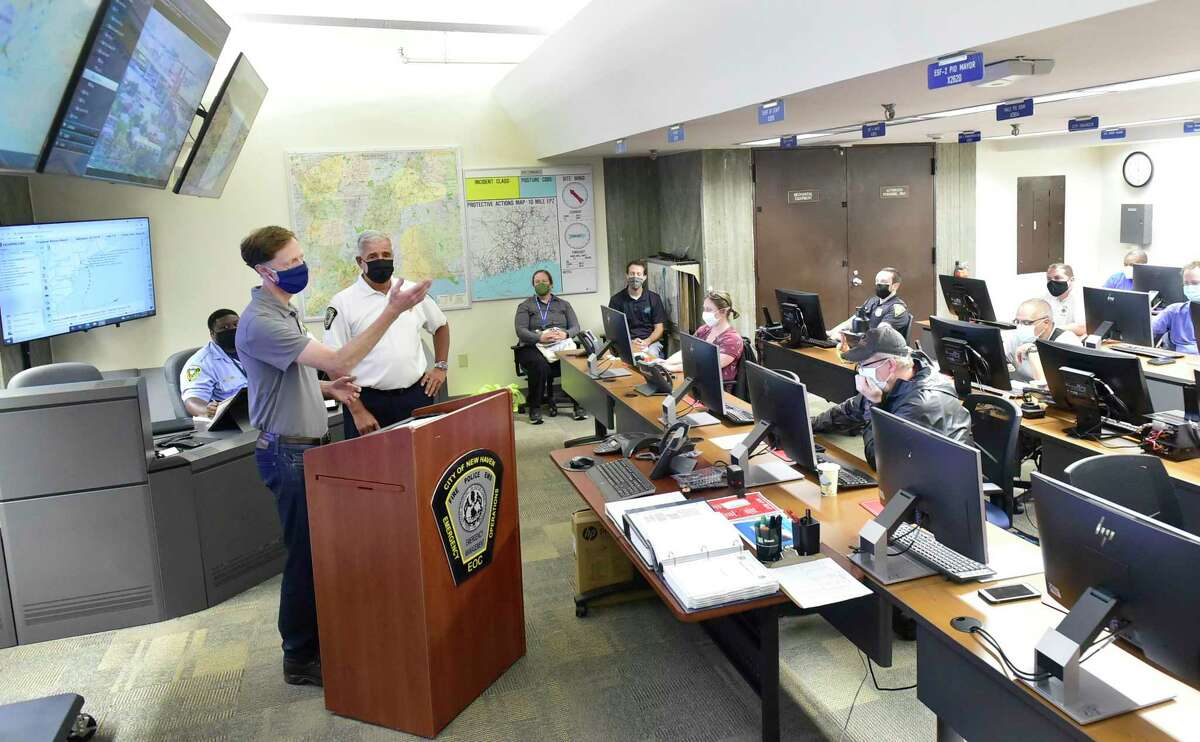 New Haven Mayor Justin Elicker, left, with Rick Fontana Director of the City of New Haven, Office of Emergency Management & Homeland Security Sunday, Sunday, August 22, 2021 at the New Haven Office of Emergency Management's Emergency Command Center where representatives of all city departments share updated status reports on Hurricane Henri.