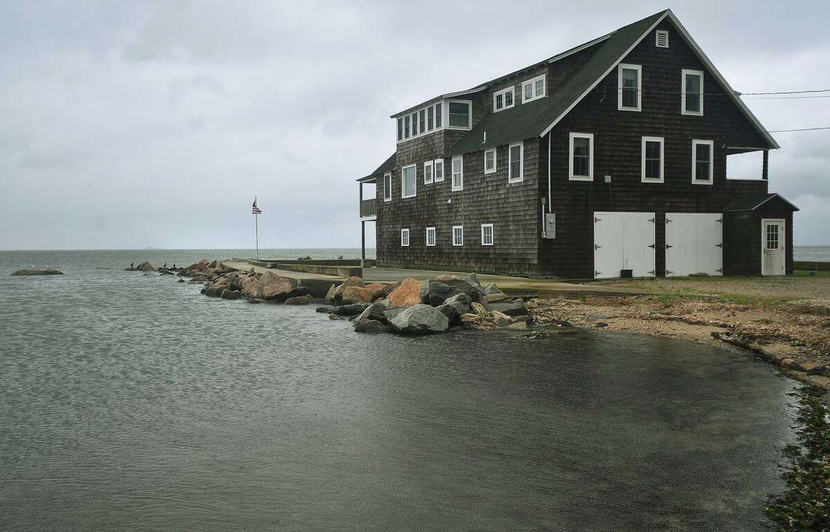 The tide is high on Circle Beach Drive in Guilford during the storm surge from Tropical Storm Henri on Sunday, August 22, 2021.