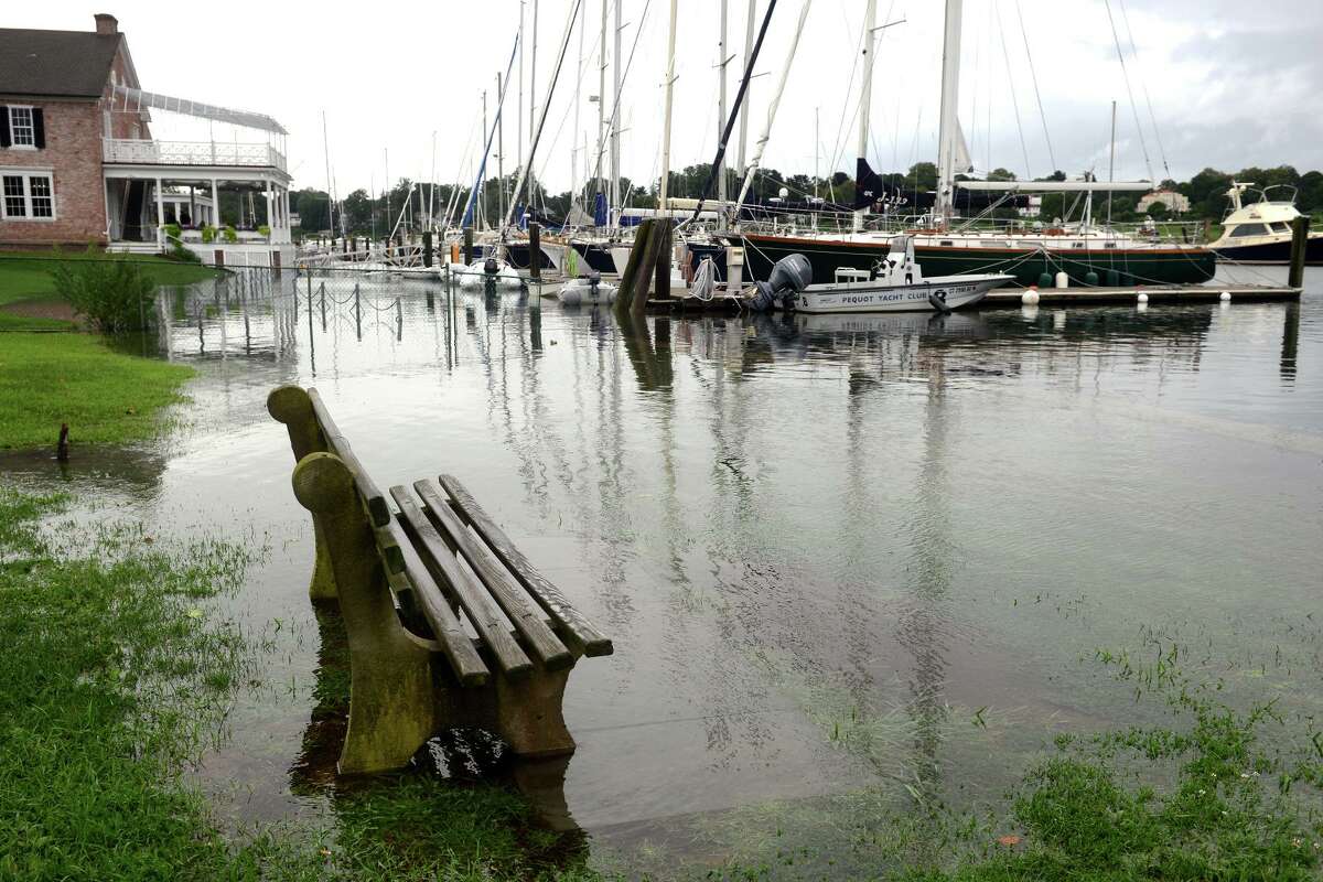 High tide brought the waters of Southport Harbor onto Perry’s Green, in Fairfield, Conn. Aug 22, 2021. As Tropical Storm Henri passed farther to the east, most of coastal Fairfield County experienced an ordinary rainy day on Sunday.