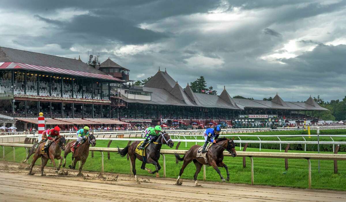 Horologist with jockey Junior Alvarado, right leads in to the Clubhouse turn and ultimately went gat to wire to win the 8th running of The Summer Colony at the Saratoga Race Course Sunday Aug 22, 2021 in Saratoga Springs, N.Y. Photo Special to the Times Union by Skip Dickstein