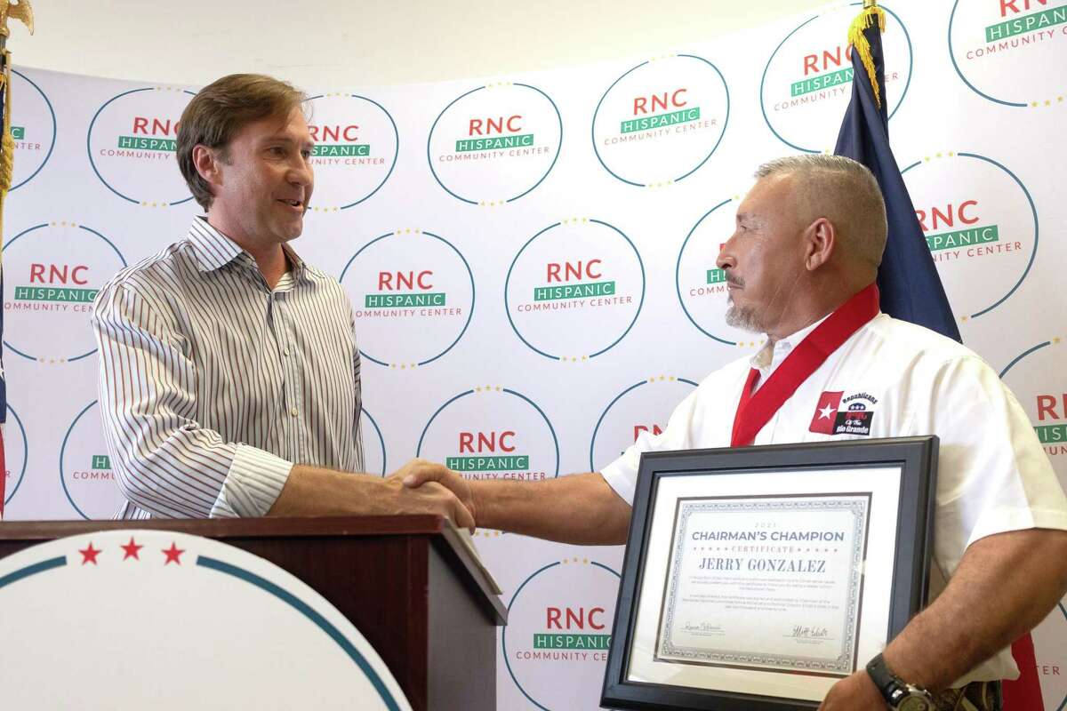 RNC Co-Chairman Tommy Hicks introduces Chairman's Champion award to Jerry Gonzalez at the RNC Hispanic Engagement Office on Aug. 21.