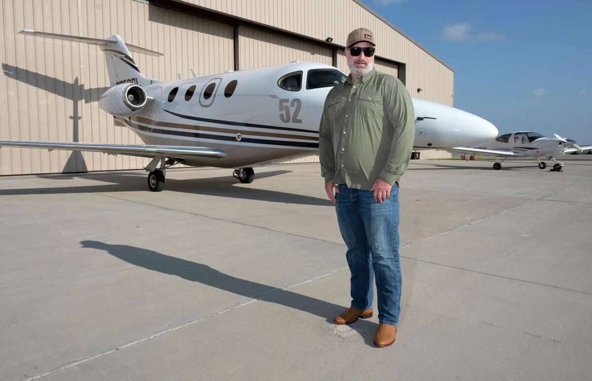 Rio Grande Helicopters Pilot Spencer Morgan poses for a feature photo Thursday, Aug. 19, 2021, at the Laredo International Airport with the plane he used to win the 23 Annual AirVenture Cup Race.