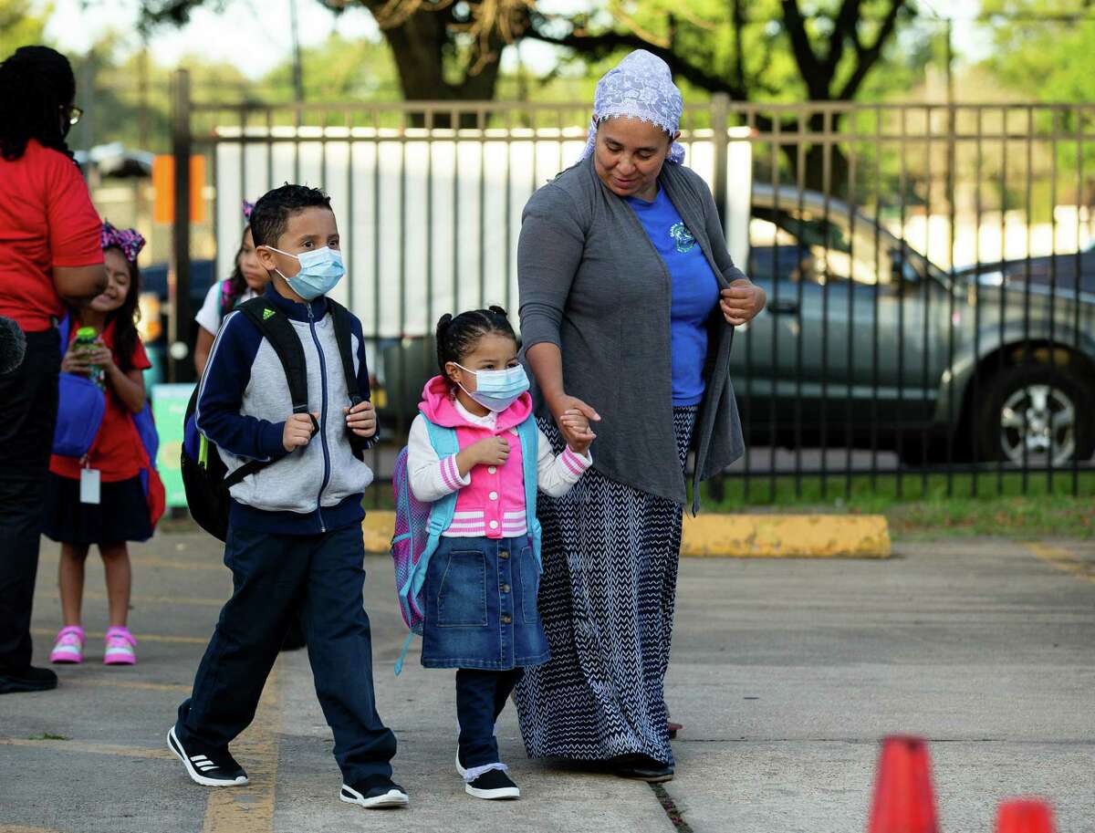 Students arrive for the first day of school at Benbrook Elementary School on Monday, Aug. 23, 2021, in Houston.