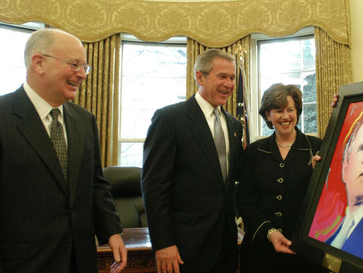 A+E Networks CEO Nick Davatzes, left, on Dec. 9, 2002, with President George W. Bush, and A&E executive Abbe Raven, in the Oval Office in Washington, D.C.