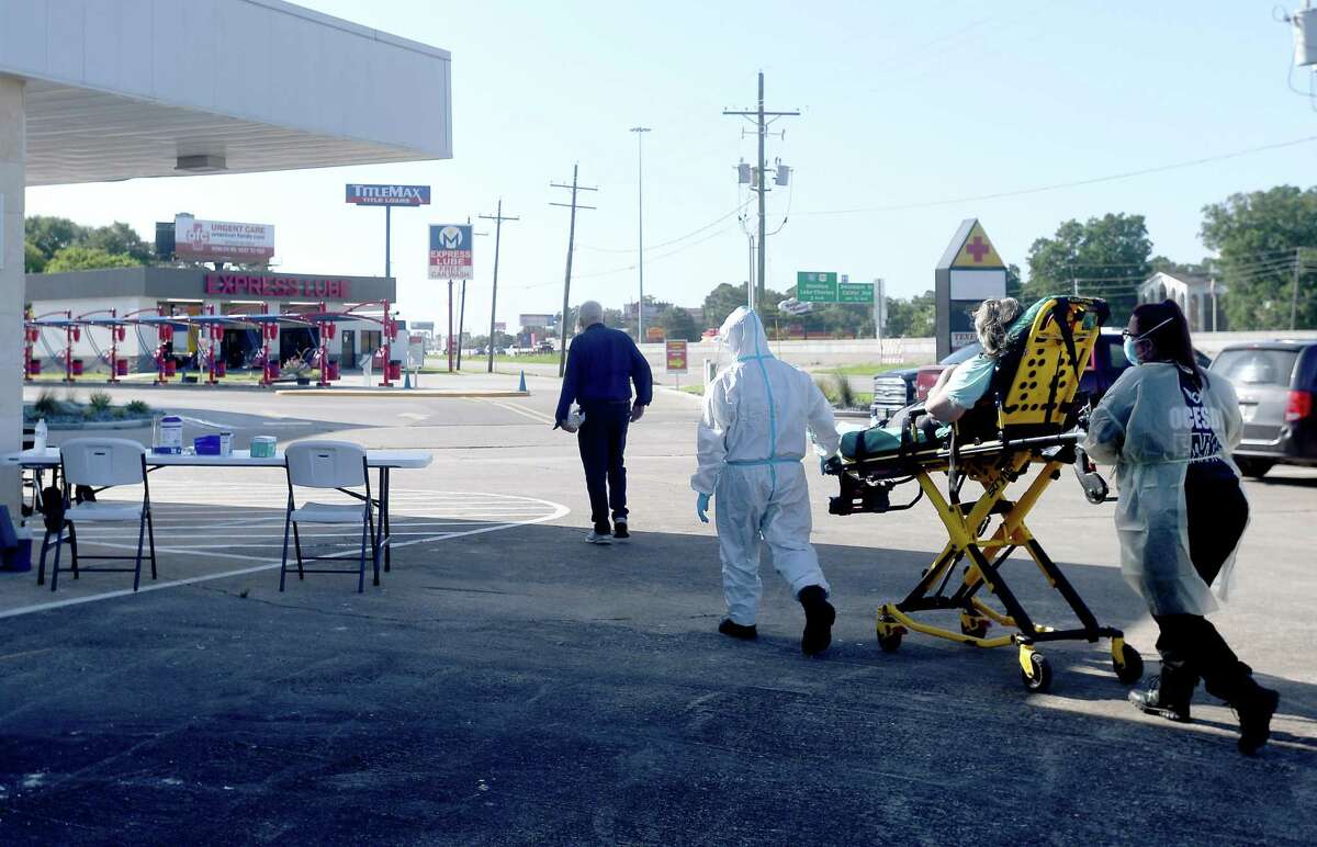 A patient is transported by ambulance workers to the new monoclonal antibody infusion center that opened Monday to help treat patients with COVID-19. The new center will be able to treat up to 150 patients daily, significantly increasing the number that can be treated amid a steep rise in cases. The treatment is free to patients 12 and older who are within 10 days of conntracting the virus and are not experiencing severe respiratory problems, Photo made Monday, August 23, 2021 Kim Brent/The Enterprise
