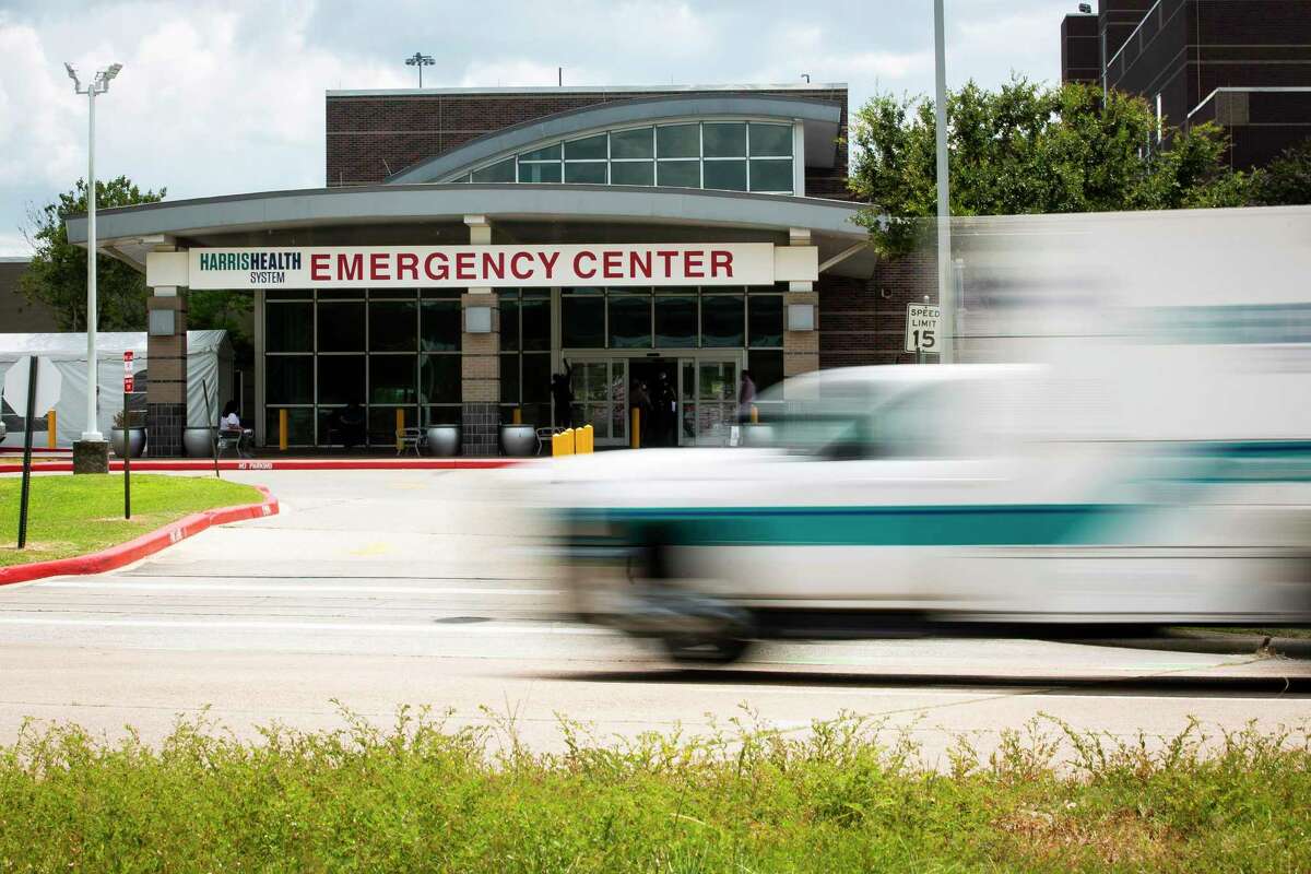 An ambulance passes Lyndon B. Johnson Hospital in Houston on Wednesday, Aug. 11, 2021. The hospital is one of at least two hospitals that have erected overflow tents in Houston. Across Texas, health officials warned of a growing crisis not seen in months, with more than 10,000 Texans hospitalized and intensive care units stretched thin. (Annie Mulligan/The New York Times)