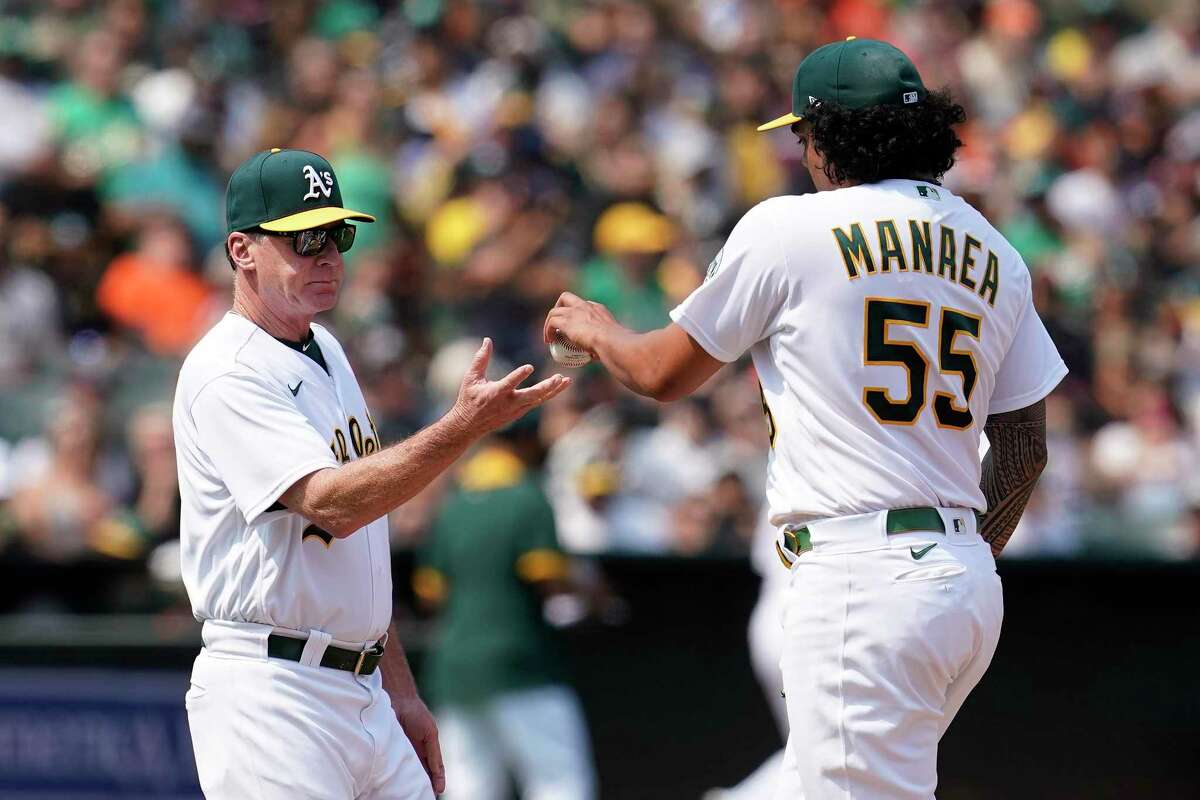 Oakland Athletics starting pitcher Sean Manaea (55) hands the ball to manager Bob Melvin as he is taken out for a relief pitcher during the fifth inning of the team's baseball game against the San Francisco Giants in Oakland, Calif., Saturday, Aug. 21, 2021. (AP Photo/Jeff Chiu)