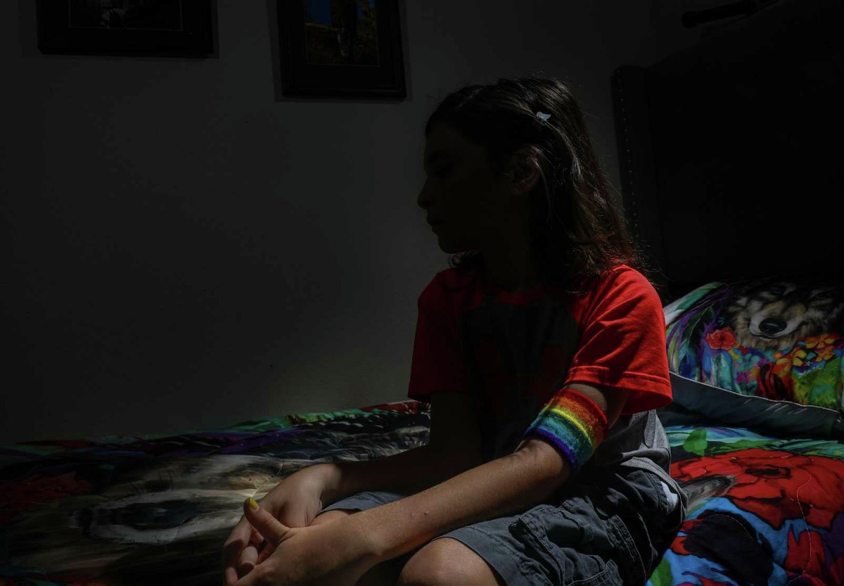 Tristan, a nonbinary fifth-grade student, poses for a portrait in their bedroom Monday, Aug. 23, 2021, in Magnolia. The child’s mother said the child has been in in-school suspension because of a Magnolia ISD policy mandating short hair. “The school is digging in its heels, and they don’t see how it’s affecting [them] and our family,” the mother said.