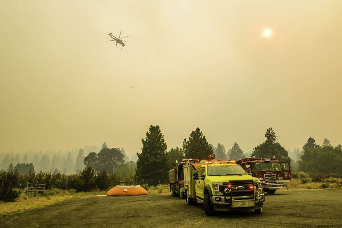 On August 20, 2021, a helicopter will be ready to launch water on Dixie Fire.