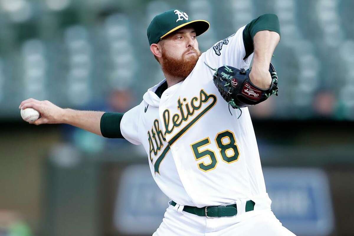 Oakland Athletics' Paul Blackburn delivers in 1st inning against Seattle Mariners during MLB game at Oakland Coliseum in Oakland, Calif., on Monday, August 23, 2021.