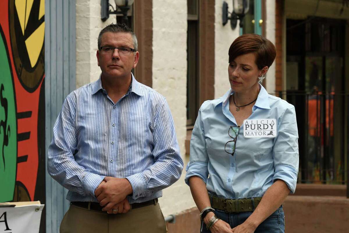 Cafe Hollywood owner Colin Rost, left, stands outside his Lark Street establishment with Republican Albany mayoral candidate Alicia Purdy, right, during a press conference held by in support of the bar, which the city shut down last month in response to escalating violence on Tuesday, Aug. 24, 2021, in Albany, N.Y.