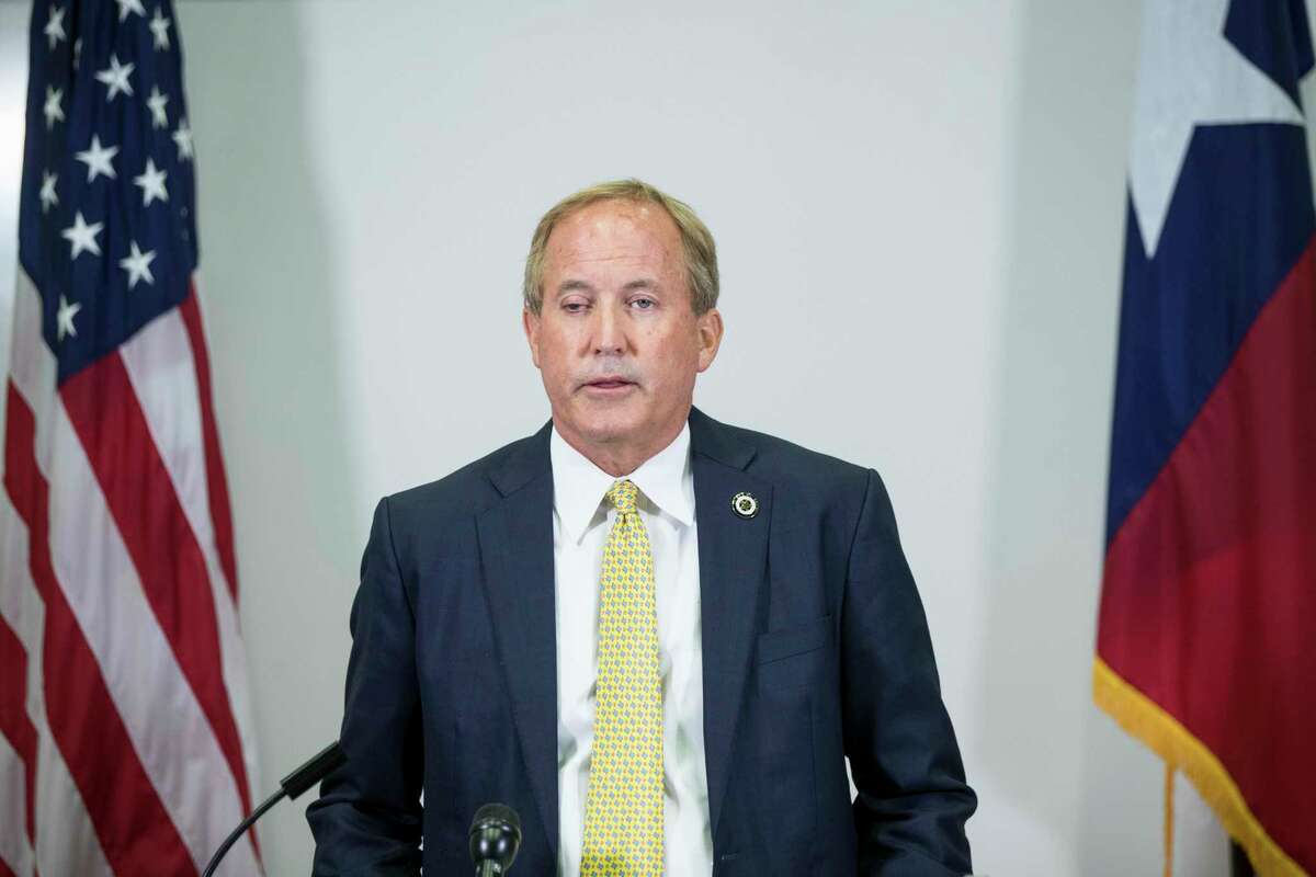 The office of Texas Attorney General Ken Paxton, shown at a Aug. 5, 2021 news conference in Houston, released an internal report on Aug. 24, 2021 that found Paxton did not accept bribes and did not misuse his office to benefit his friend and campaign donor Nate Paul, despite a continuing FBI investigation of the matter.