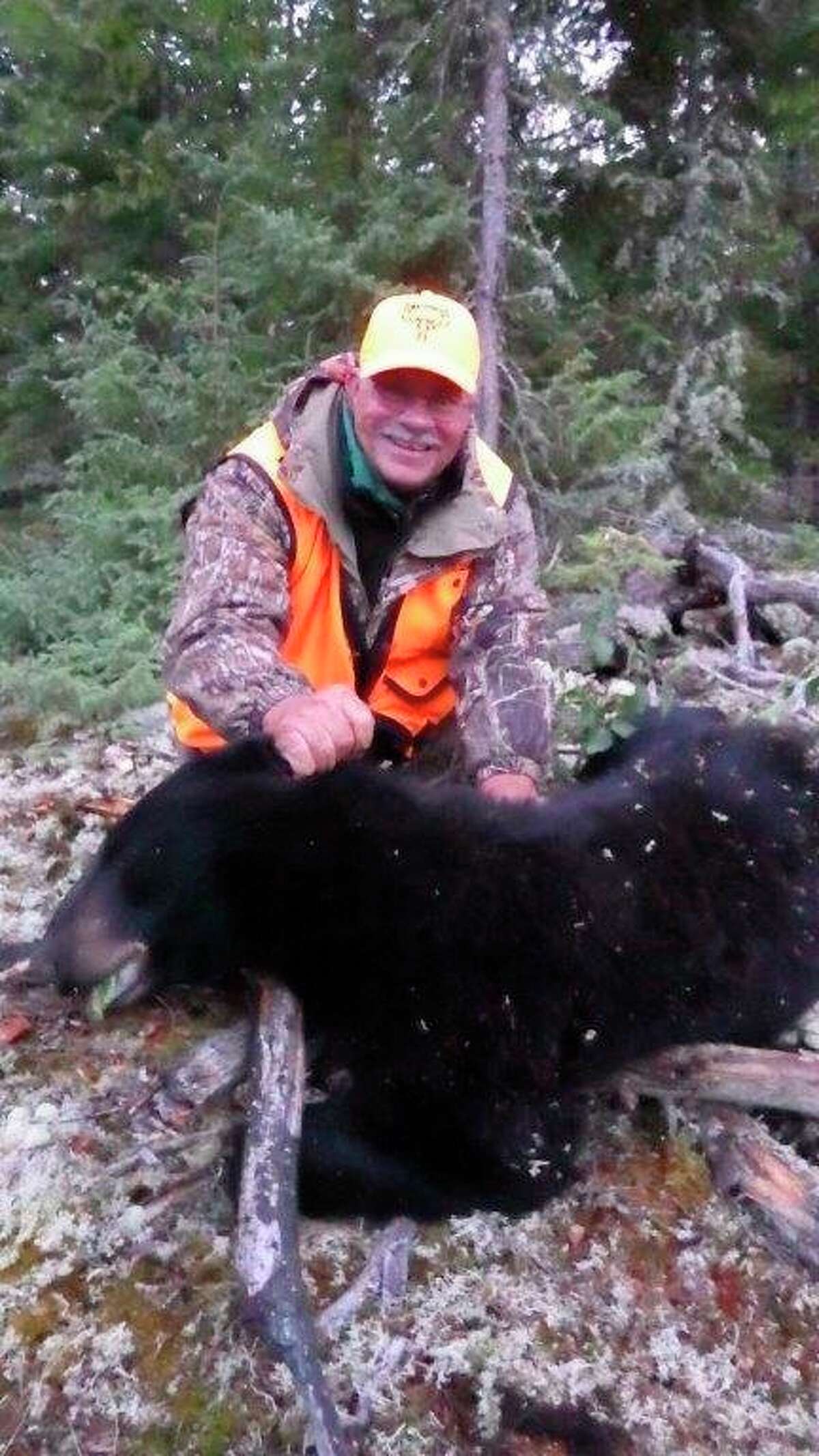 The writer thoroughly enjoys black bear hunting. This Ontario bruin was taken over bait at 15 yards, using a crossbow from an improvised ground blind. (Photo provided by Tom Lounsbury/Hearst Michigan)