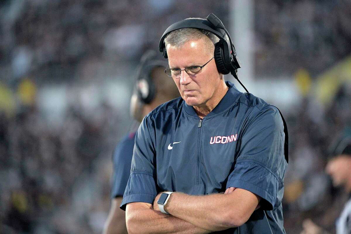 UConn coach Randy Edsall walks along the sideline during the first half against Central Florida in 2019 in Orlando, Fla. Edsall announced on Sunday that we will retire at the end of the season.