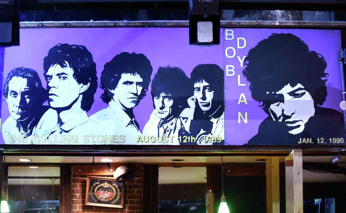 Paintings of the Rolling Stones and Bob Dylan hang at Toad's Place in New Haven on February 1, 2018.