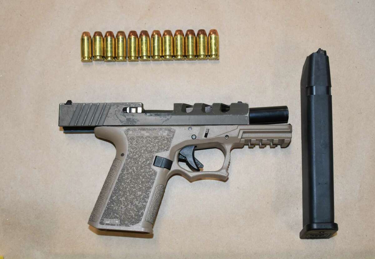 A loaded polymer non-serialized handgun — known as a “Ghost gun" — with a 30-round magazine.