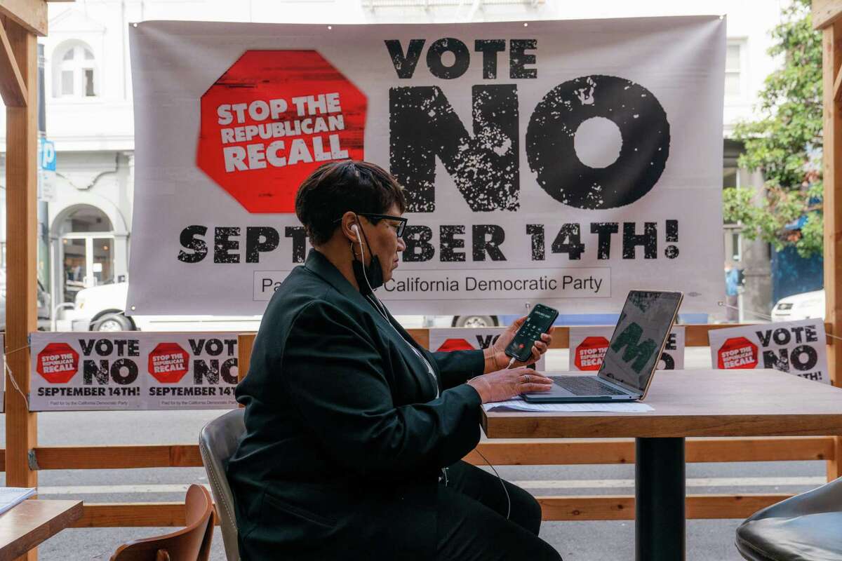 A volunteer calls voters as part of the “Vote No” campaign urging California voters to vote against the recall of California Gov. Gavin Newsom in San Francisco on Aug. 13.