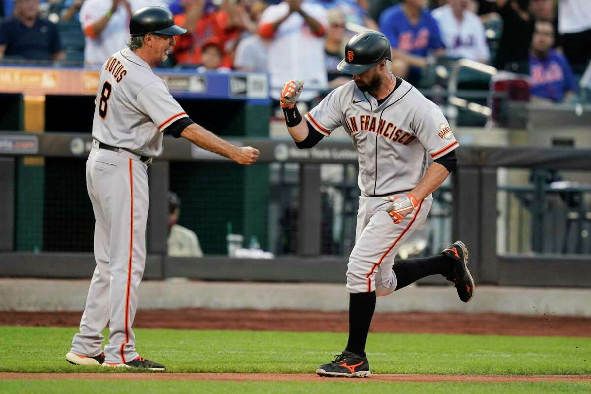 Buster Posey hits Giants first base coach during batting practice