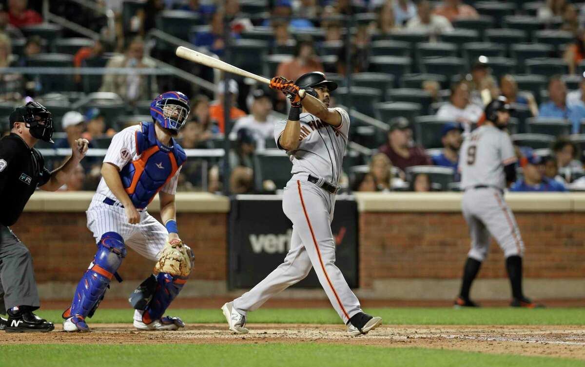 NEW YORK, NEW YORK - AUGUST 24: LaMonte Wade Jr. #31 of the San Francisco Giants follows through on his fourth inning two run home run against the New York Mets at Citi Field on August 24, 2021 in New York City. (Photo by Jim McIsaac/Getty Images)
