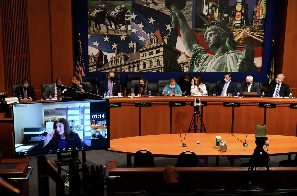 Former Joint Commission on Public Ethics (JCOPE) commissioner Julia Garcia, lower left, offers testimony during a public hearing on the state?•s system of ethics oversight and enforcement on Wednesday, Aug. 25, 2021, at the Legislative Office Building in Albany, N.Y. .