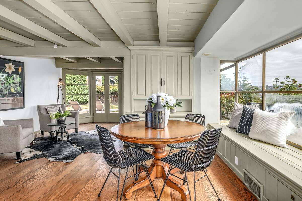 Windows, doors, and walls of glass let the light and the views into the home. 