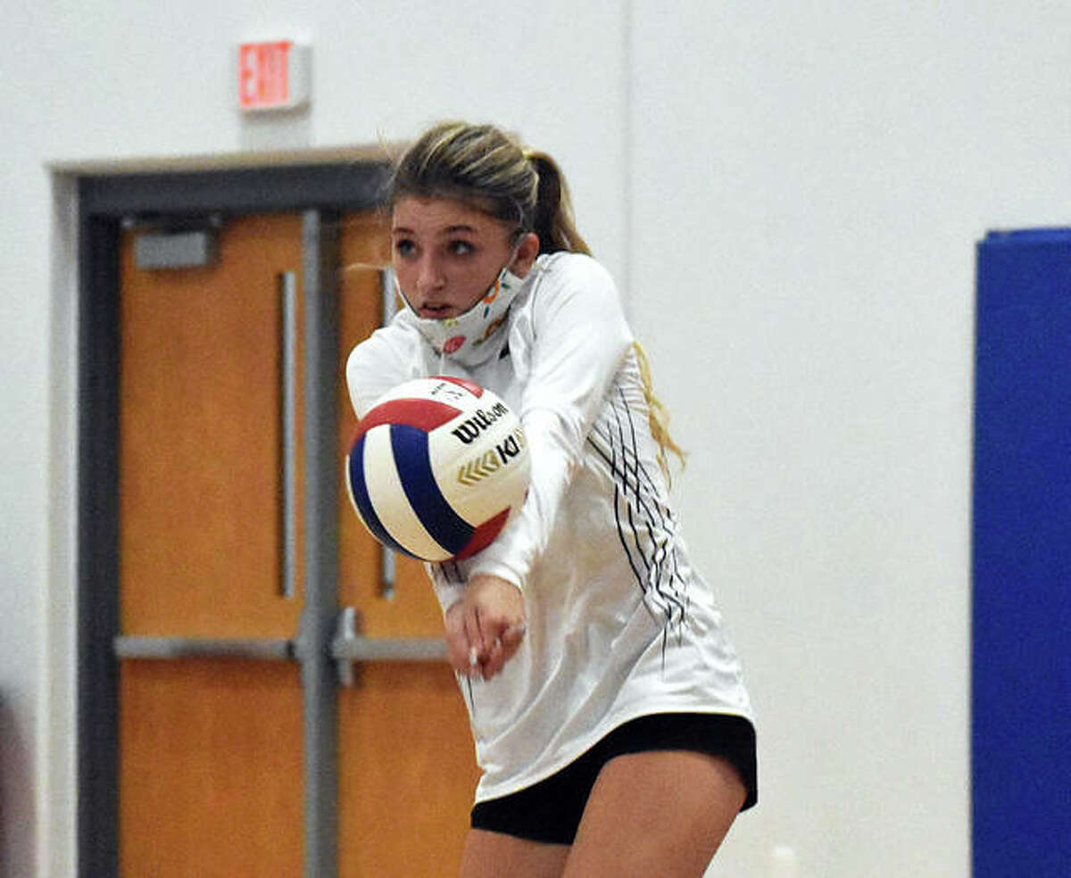Father McGivney sophomore Madeline Hylla successfully receives a serve during the first game against Granite City in the Roxana Tournament on Monday in Roxana.
