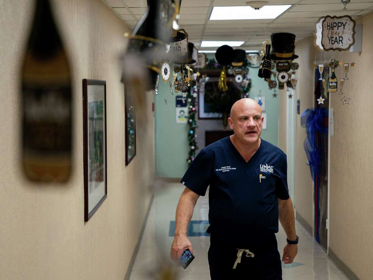 Dr. Joseph Varon, the chief medical officer at United Memorial Medical Center, walks back to the COVID-19 Intensive Care Unit onTuesday, Dec. 22, 2020, in Houston.