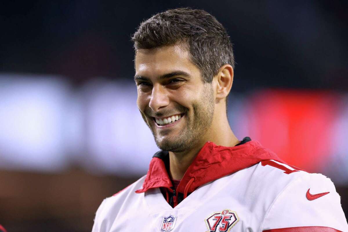 INGLEWOOD, CALIFORNIA - AUGUST 22: Jimmy Garoppolo #10 of the San Francisco 49ers smiles as he leaves the field in a 15-10 win during a preseason game between the Los Angeles Chargers and the San Francisco 49ers at SoFi Stadium on August 22, 2021 in Inglewood, California. (Photo by Harry How/Getty Images)