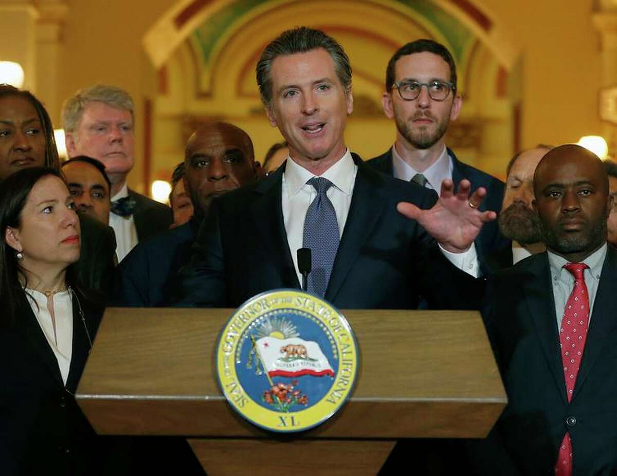 Gov. Gavin Newsom discusses his decision to place a moratorium on the death penalty during a news conference at the Capitol in Sacramento.