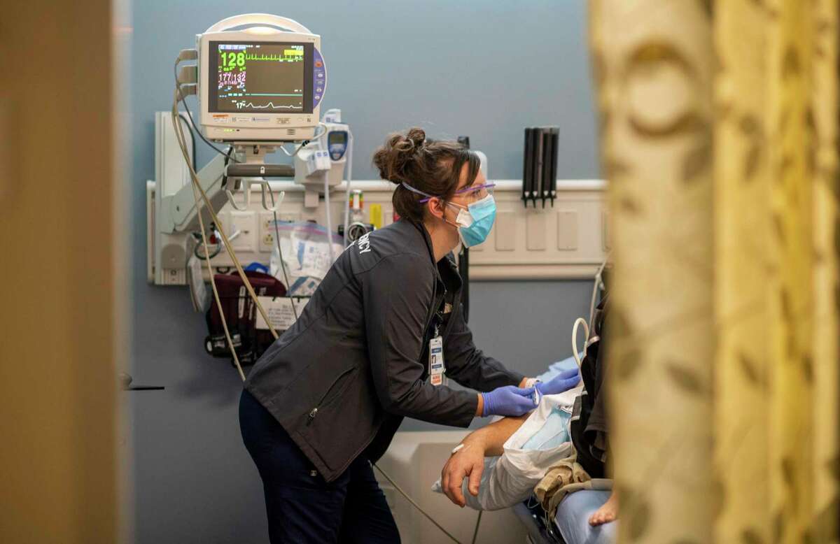 Kristen Marin, MSN, RN, CEN, gives a patient an IV. She is a nurse at Adventist Health Ukiah Valley Hospital in Ukiah, Calif. 