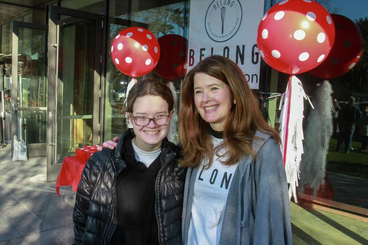 Ellie Brown, left, with her mother, Kim Brown, before the prayer dedication at the pre-built-out space for Belong Kitchen in Houston on February 20, 2021. Kim founded the bakery.