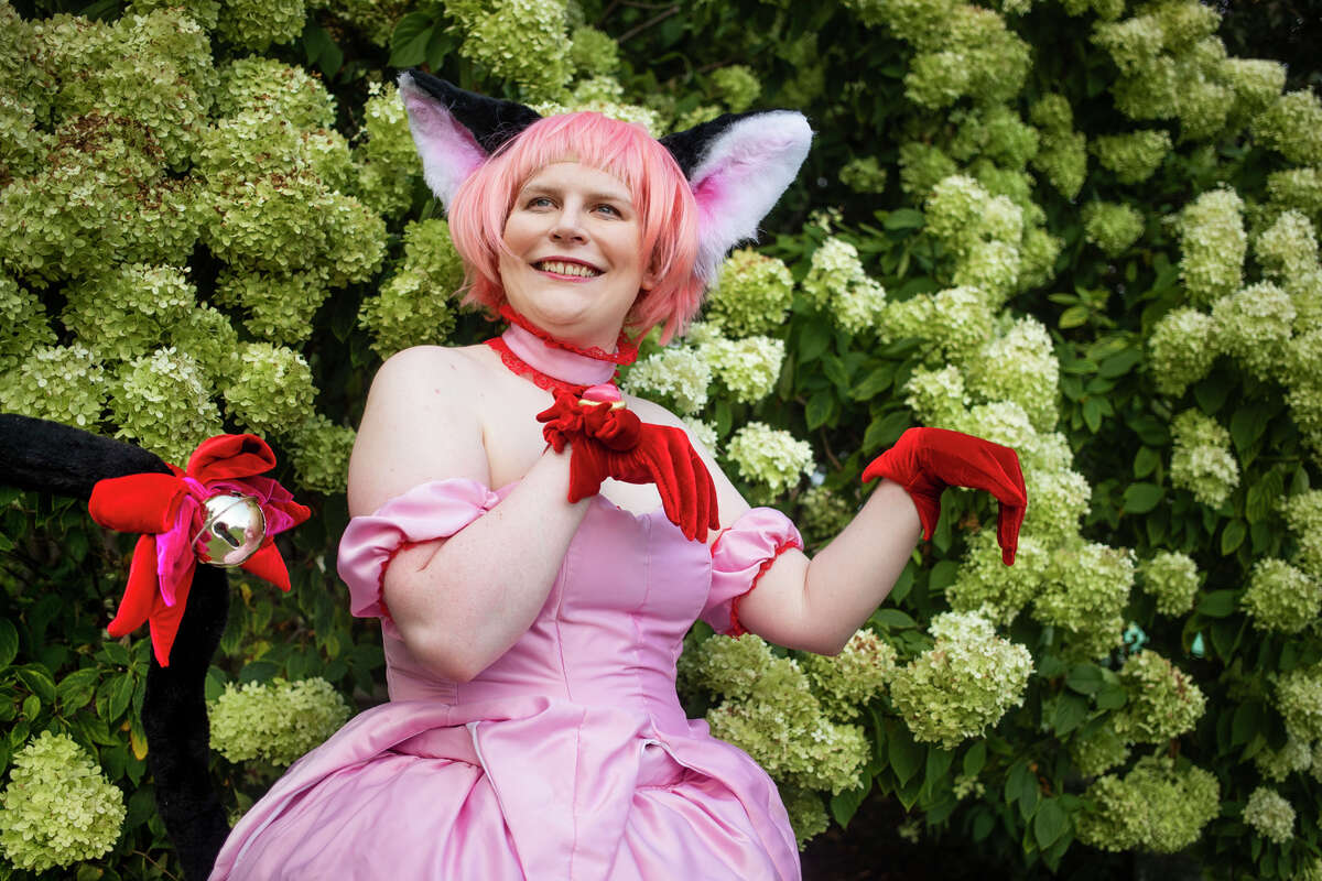 Emma Vanderlinden poses for a portrait wearing her handmade cosplay outfit, styled as the character Ichigo from the "Tokyo Mew Mew" manga series, Wednesday, Aug. 25, 2021 in downtown Midland. (Katy Kildee/kkildee@mdn.net)