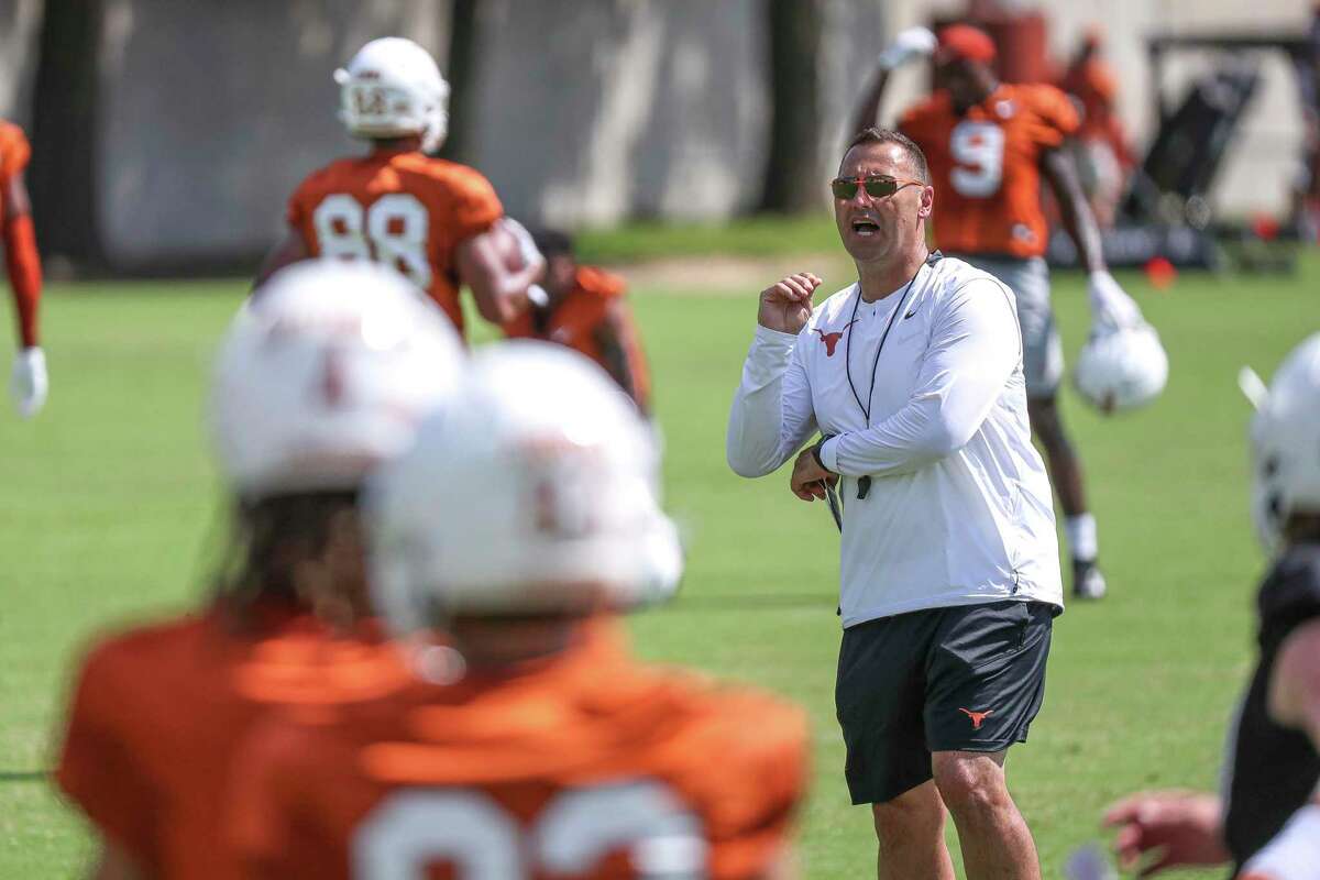 FILE - In this Aug. 7, 2021, file photo, Texas coach Steve Sarkisian watches players run drills during an NCAA college football practice in Austin, Texas. Texas gave Sarkisian, a former head coach at Washington and Southern California, a guaranteed six-year, $34 million contract that should take him into the eventual move to the SEC planned for 2025, if it doesn't happen sooner. (Aaron E. Martinez/Austin American-Statesman via AP, File)
