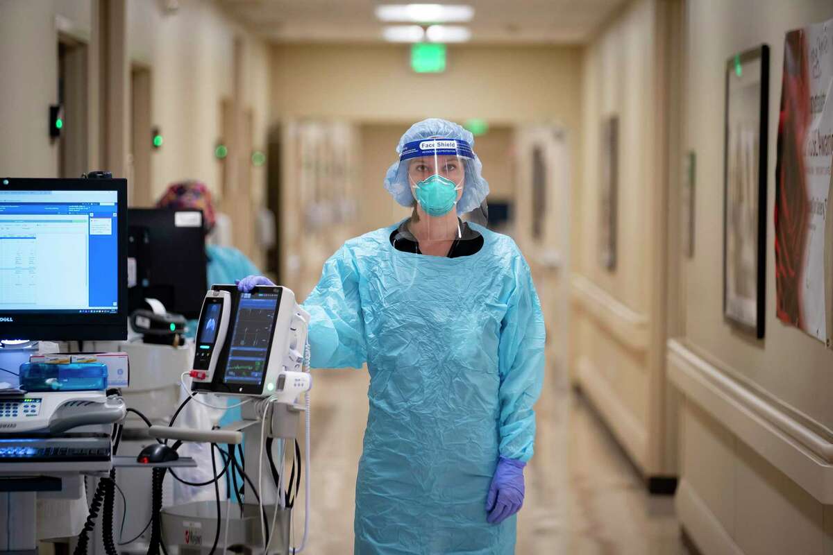 Dr. Nicole Zeisig, a hospitalist at Memorial Hermann Sugar Land Hospital, prepares to make rounds, Wednesday, Aug. 25, 2021, in Sugar Land. Dr. Zeisig recently penned an essay about the frustrations of working during the pandemic.