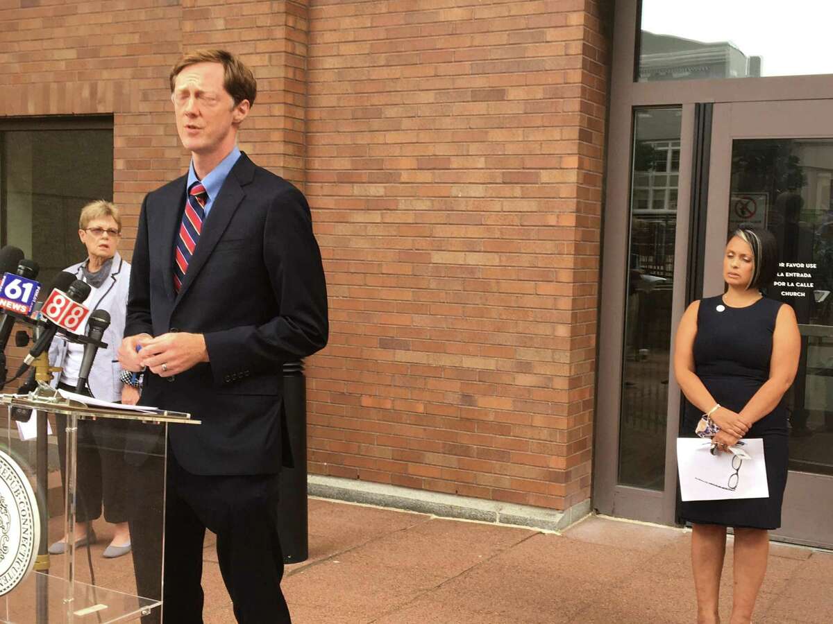 Mayor Justin Elicker announces a COVID-19 vaccine or testing mandate for 2,000 city employees on Friday, Aug. 27, 2021.With him are Corporation Counsel Patricia King, left, and Director of Health Maritza Bond, right.