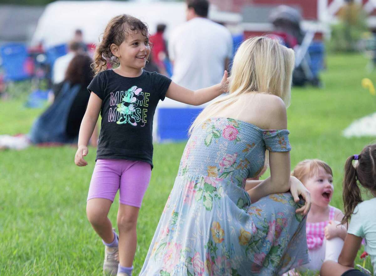 Lina Grant, 4, of Woodbridge plays Duck, Duck, Goose at Ambler Farm's Sayonara to Summer concert with Grateful Dead tribute band, Bear's Choice, on Saturday, Aug. 21, 2021, in Wilton; Connecticut.