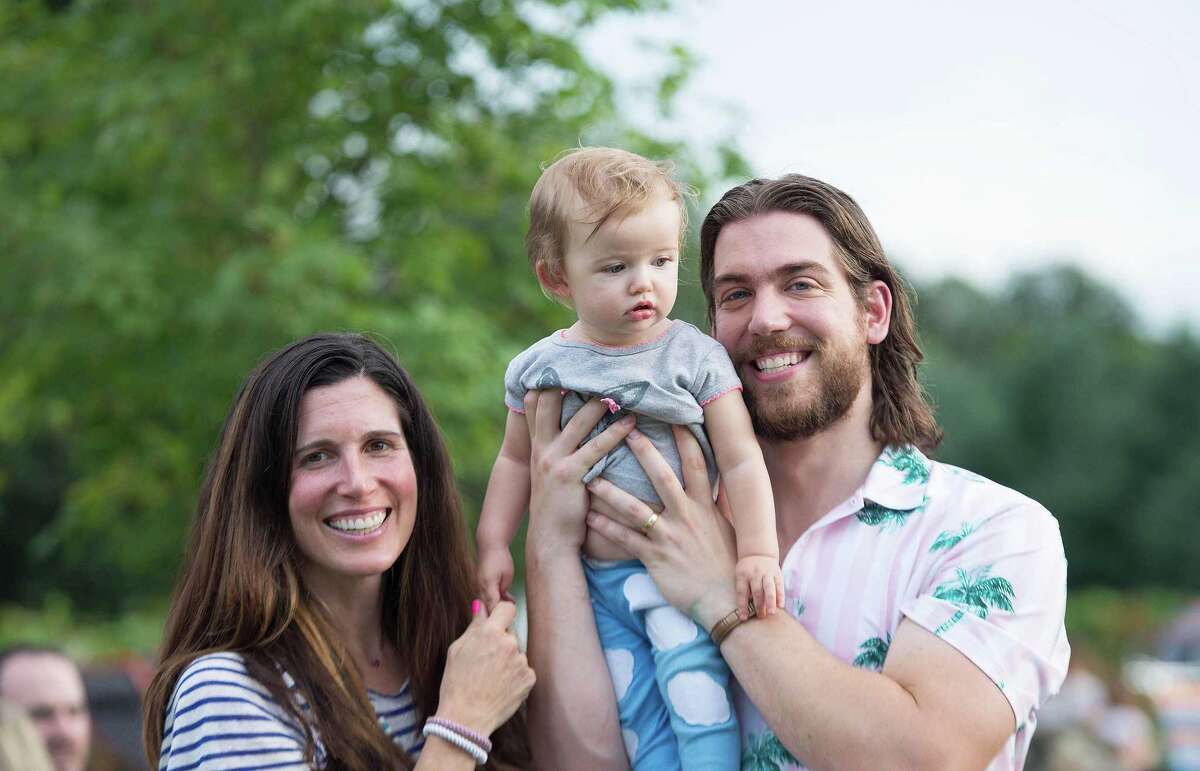 Kat, Isabelle, 11-months, and Josh Kopac at Ambler Farm's Sayonara to Summer concert with Grateful Dead tribute band, Bear's Choice, on Saturday, Aug. 21, 2021, in Wilton, Connecticut.