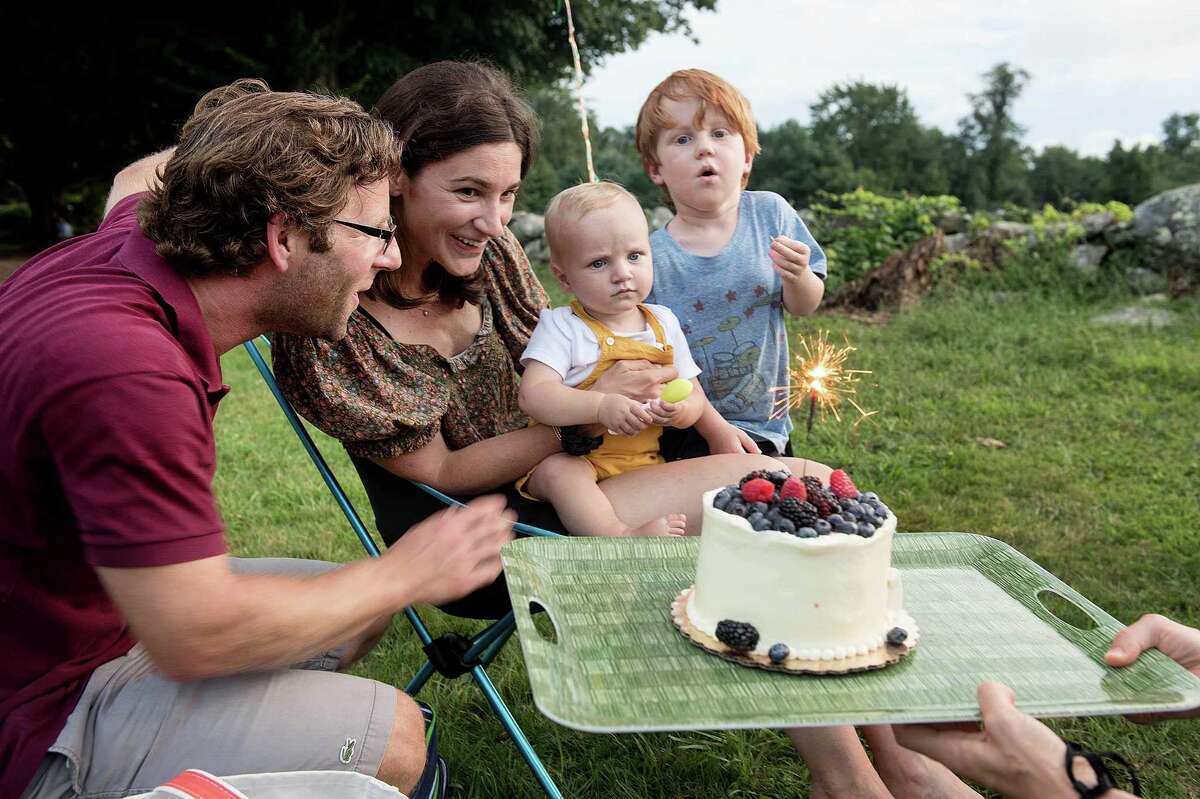 Max Leslie celebrates his first birthday with his father, John, mother, Kate, and brother, Will, at Ambler Farm's Sayonara to Summer Show. The Grateful Dead tribute band, Bear's Choice, performed the last installment of the concert series on Saturday. John Leslie is the guitarist in Bear's Choice.