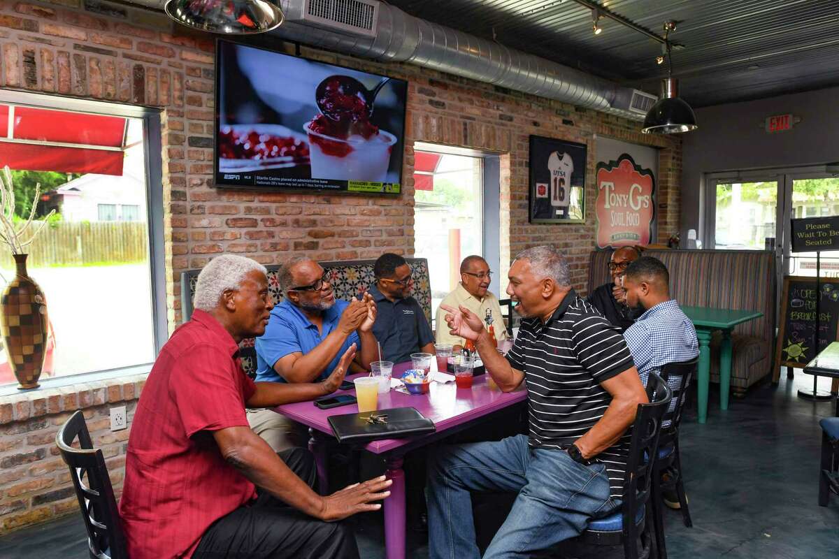 The men who meet Fridays at Tony G’s restaurant on the East Side, including from left, Joe Linson, Llewellyn Fambles, Dwayne Robinson, Frank Dunn, Tony Gradney, Aubry Lewis and Alexandre Dixon formed the Denver Heights Business Group to help improve their community.