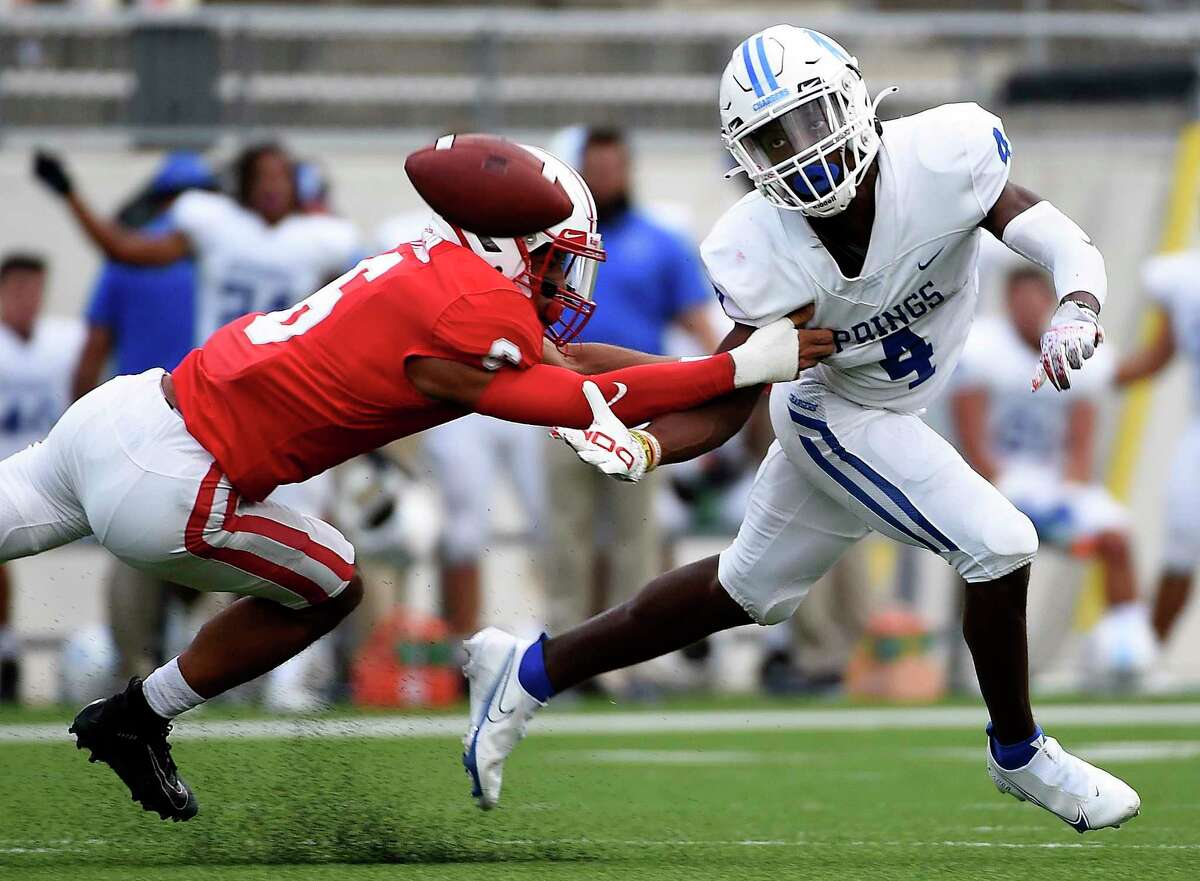 Clear Springs wide receiver Ky woods, right, attempts to catch a pass as Katy defensive back Arian Parish defends during the first half of a high school football game, Friday, Aug. 27, 2021, in Katy.