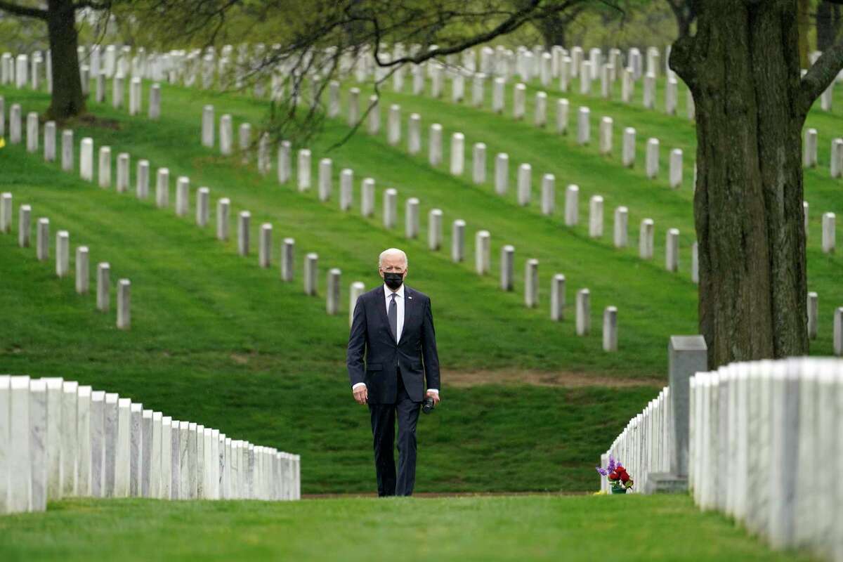 FILE - In this April 14, 2021, file photo President Joe Biden visits Section 60 of Arlington National Cemetery in Arlington, Va.