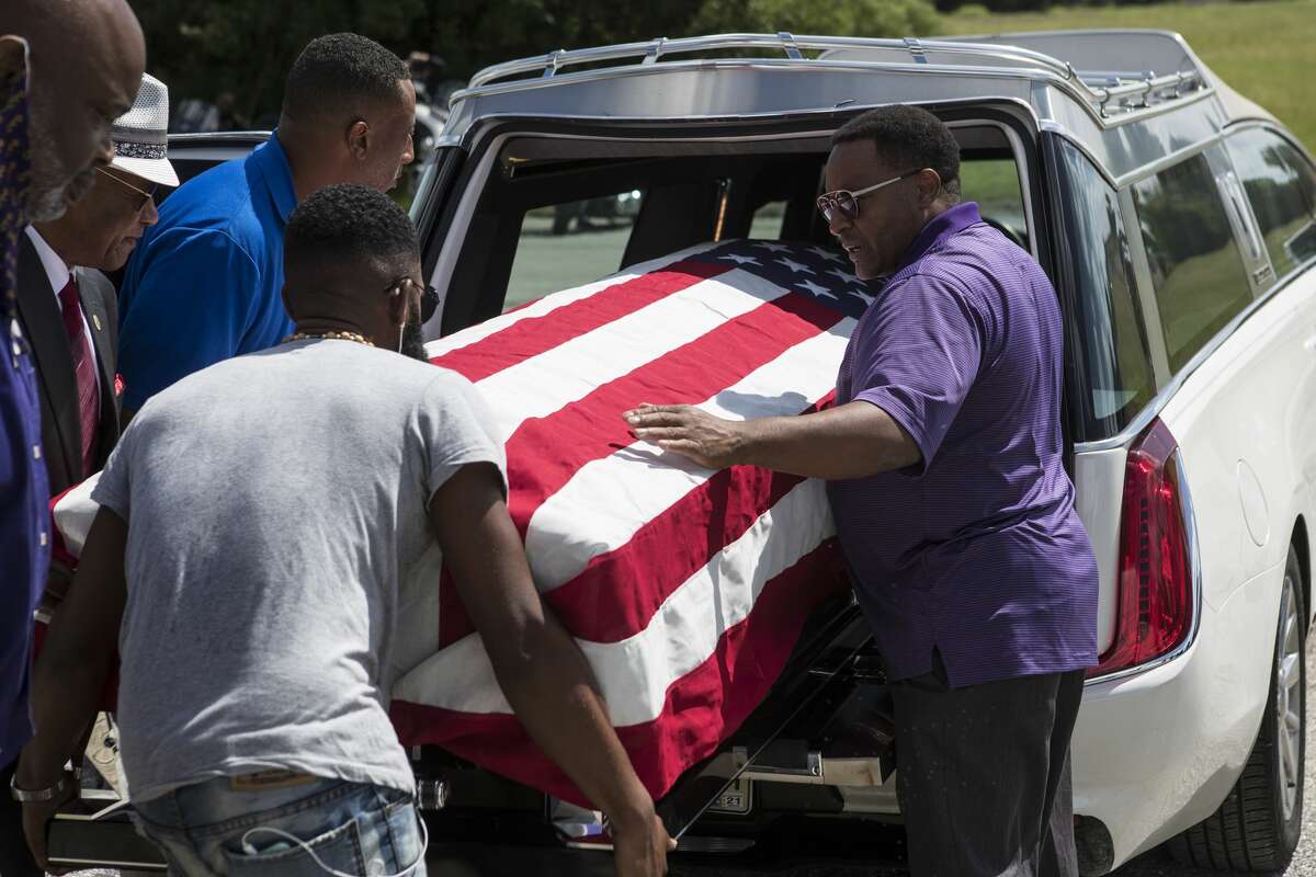 The body of New Orleans Police detective Everett Briscoe is escorted from the Respect for Life Funeral Home for the journey back to New Orleans on Tuesday, Aug. 24, 2021 in Houston. Briscoe was shot and killed Saturday at Grotto Ristorante during an attempted robbery while visiting Houston with his fraternity.