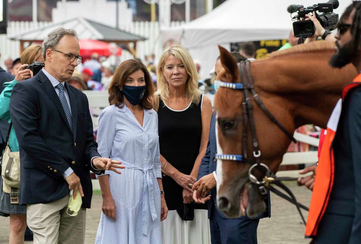 Governor Kathy Hochul is accompanied by her husband Bill Hochul as the visit the paddock before the Travers Stakes at the Saratoga Race Course Saturday Aug 28, 2021 in Saratoga Springs, N.Y. Special to the Times Union Photo Special to the Times Union by Skip Dickstein