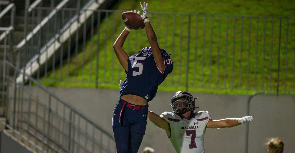 Tompkins Falcons DB Maliik Edwards (5) makes an interception in front of Magnolia Bulldogs WR Ethan King (7) during second half of action between Tompkins Falcons vs. Magnolia Bulldogs during a high school football game at the Legacy Stadium, Saturday, August 28, 2021, in Katy. Tompskins Falcons defeated Magnolia Bulldogs 18-6. (Juan DeLeon/Contributor)