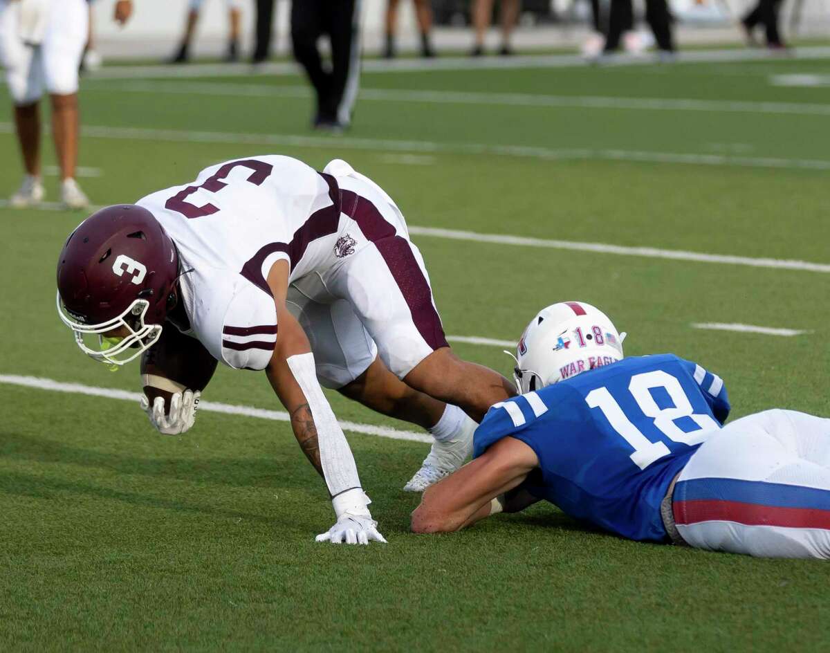 Clear Creek running back Jeremiah Crum (3) is brought down by Oak Ridge linebacker Matthew Humplik (18) during the first quarter of a non-district football game at Woodforest Bank Stadium, Saturday, Aug. 28, 2021 in Shenandoah, Texas.