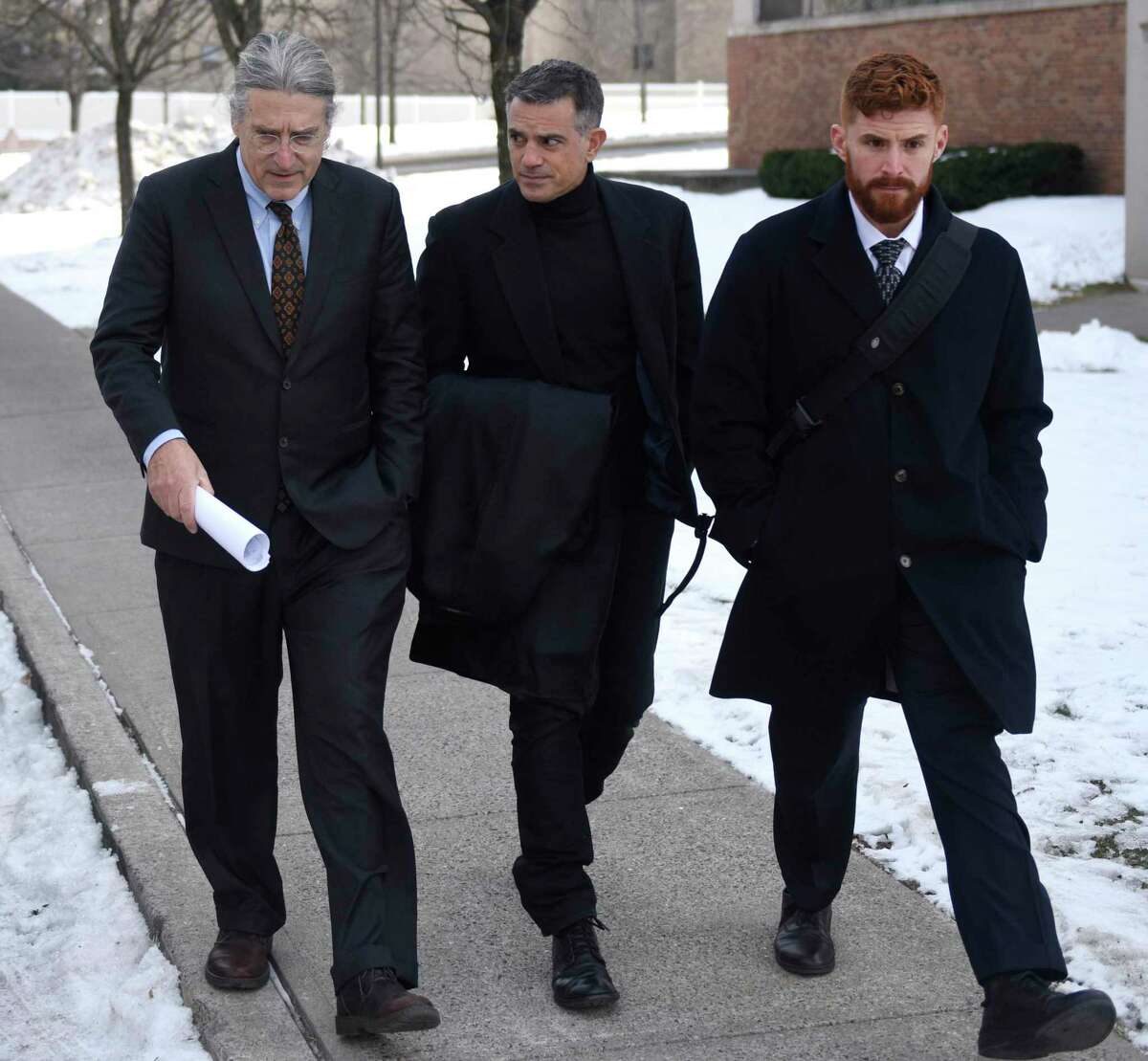 Fotis Dulos, center, leaves after his murder case hearing with attorneys Norm Pattis, left and Chris La Tronica at Connecticut Superior Court in Stamford, Conn. Thursday, Jan. 23, 2020.