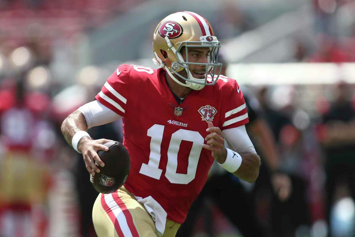 San Jose, California, USA. August 10, 2019: San Francisco 49ers quarterback  Jimmy Garoppolo (10) has a laugh on the sideline during the NFL preseason  game between the Dallas Cowboys and the San